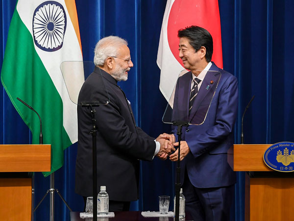 Modi Shinzo Abe shaking hands