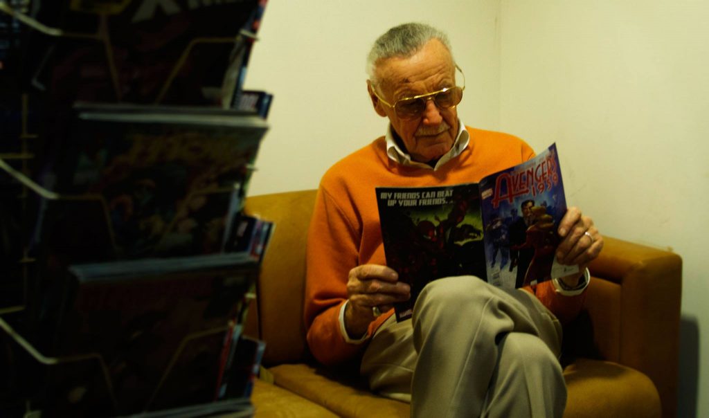 Stan Lee reading comic book