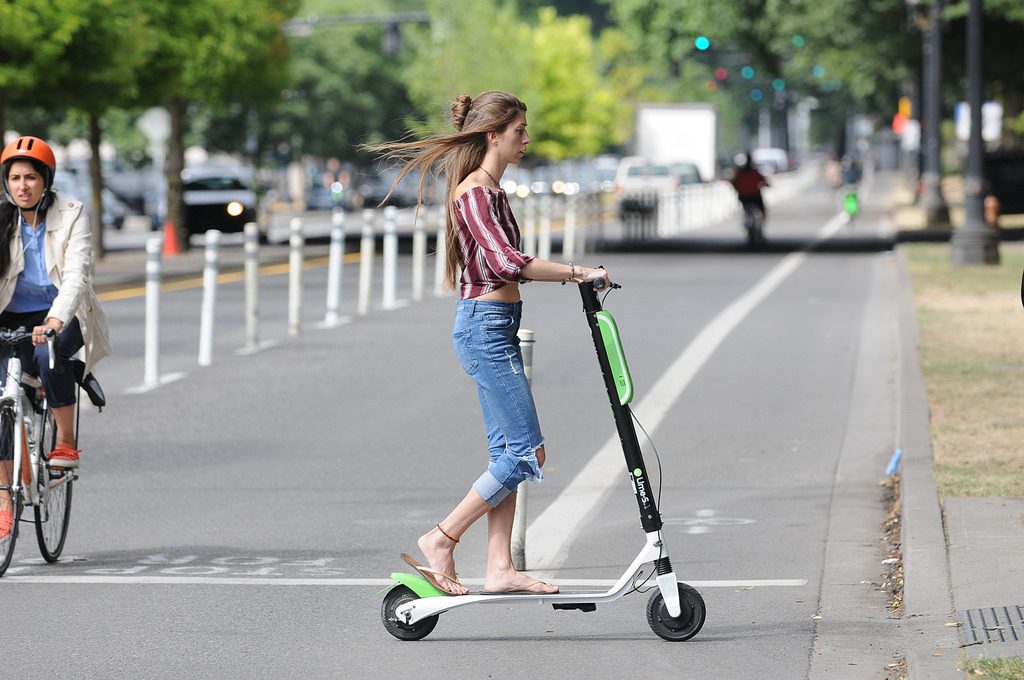 A women riding e-scooter