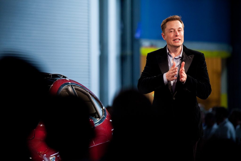 Elon Musk giving a talk at an event