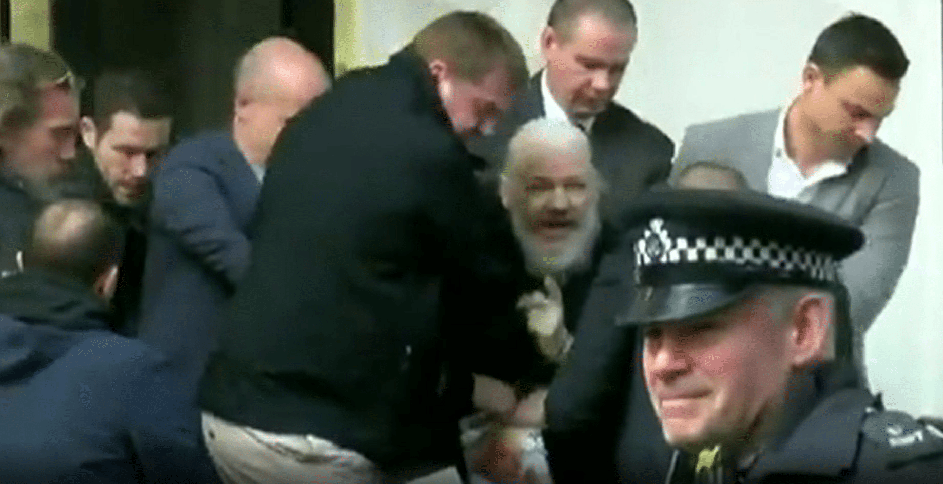 Julian Assange being arrested by UK police outside Ecuador embassy